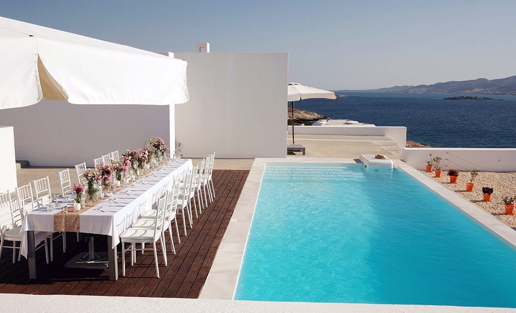 Destination wedding in island paros table by the pool